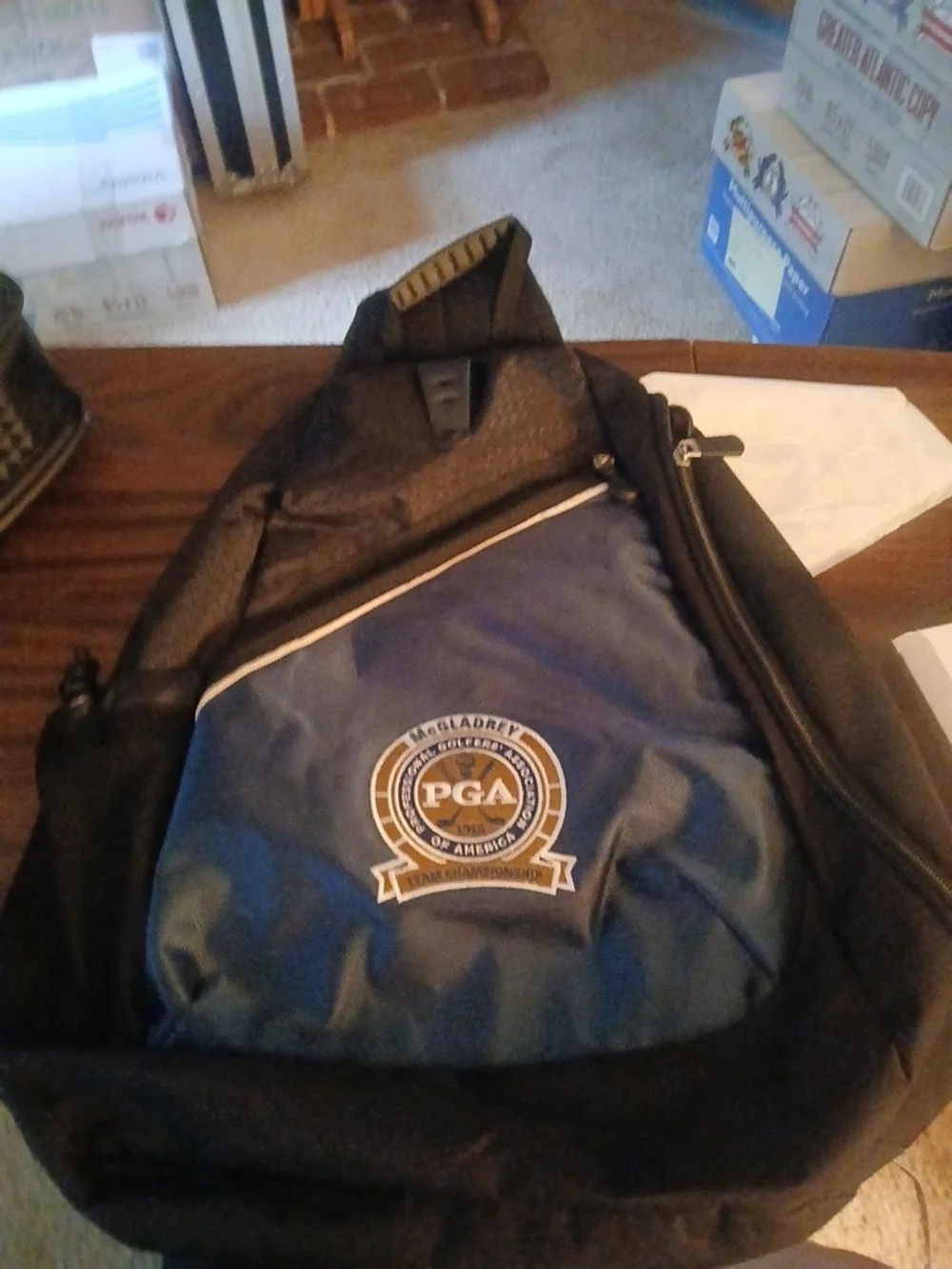 PGA Tour Black and Navy Blue Sling Backpack with PGA Logo